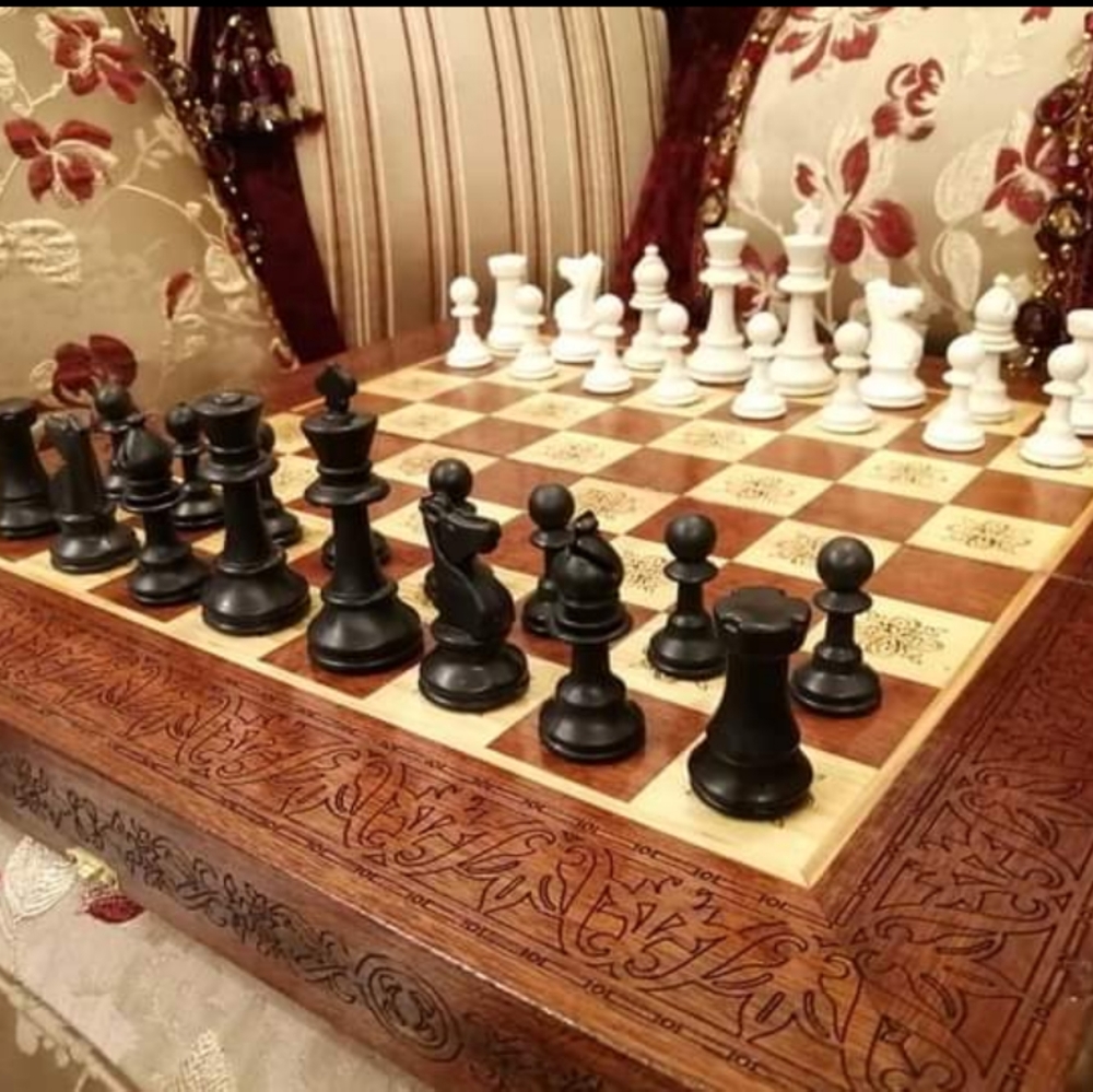 Hand carved game board with game pieces